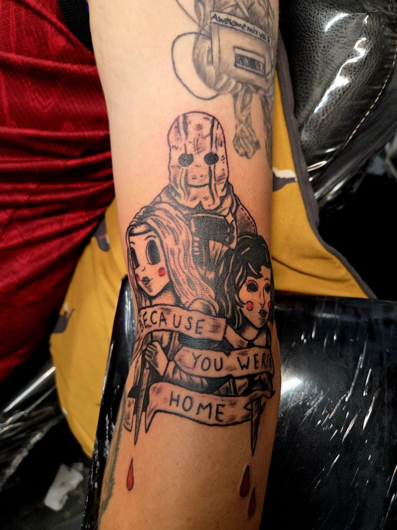 Illustrated family and home themed forearm tattoo