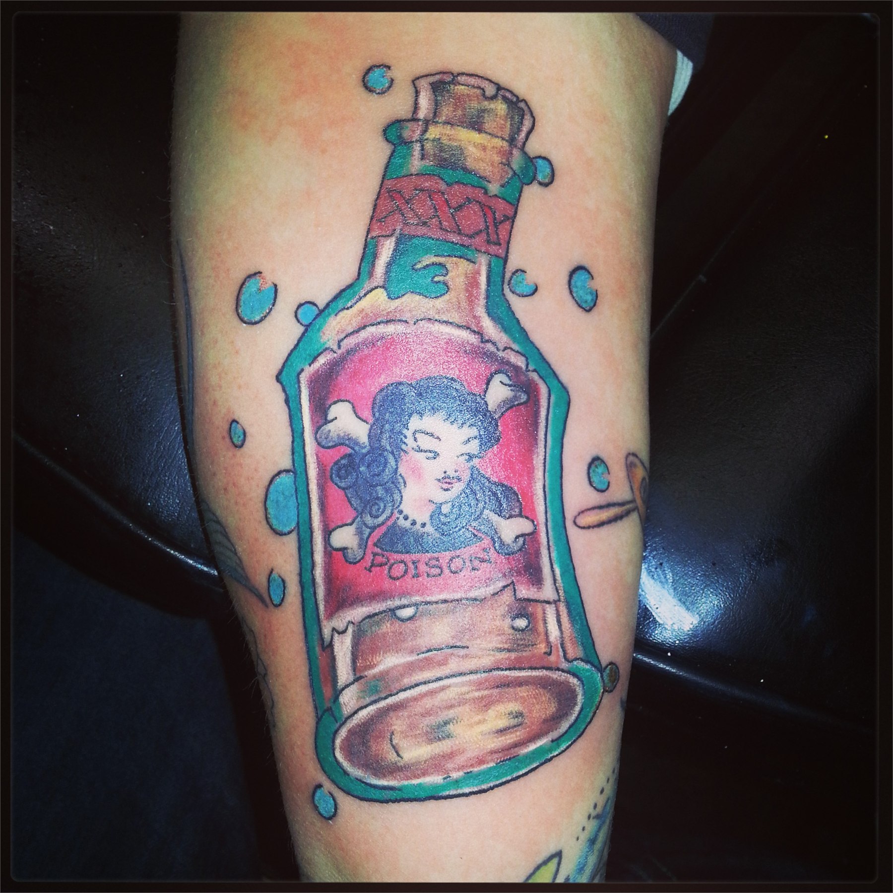 Colour traditional poison bottle tattoo