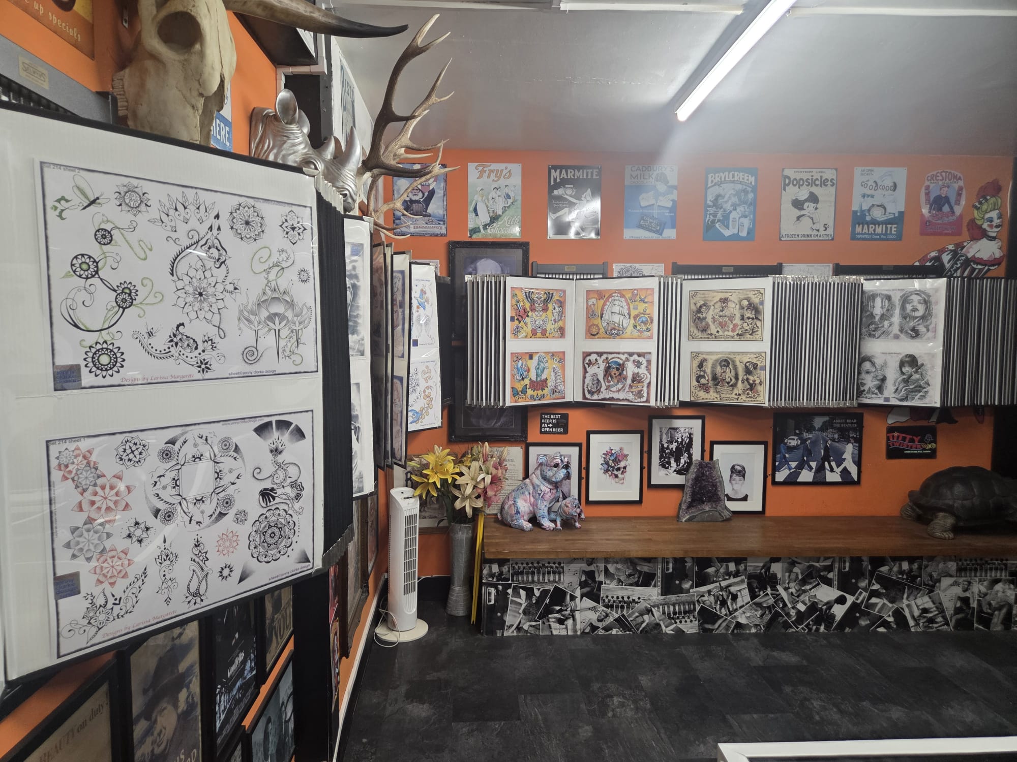 The artwork-filled interior of Lilly Ink on Prospect Street